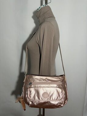 Kipling Syro Rose Gold Metallic Convertible Crossbody Bag With Monkey Charm